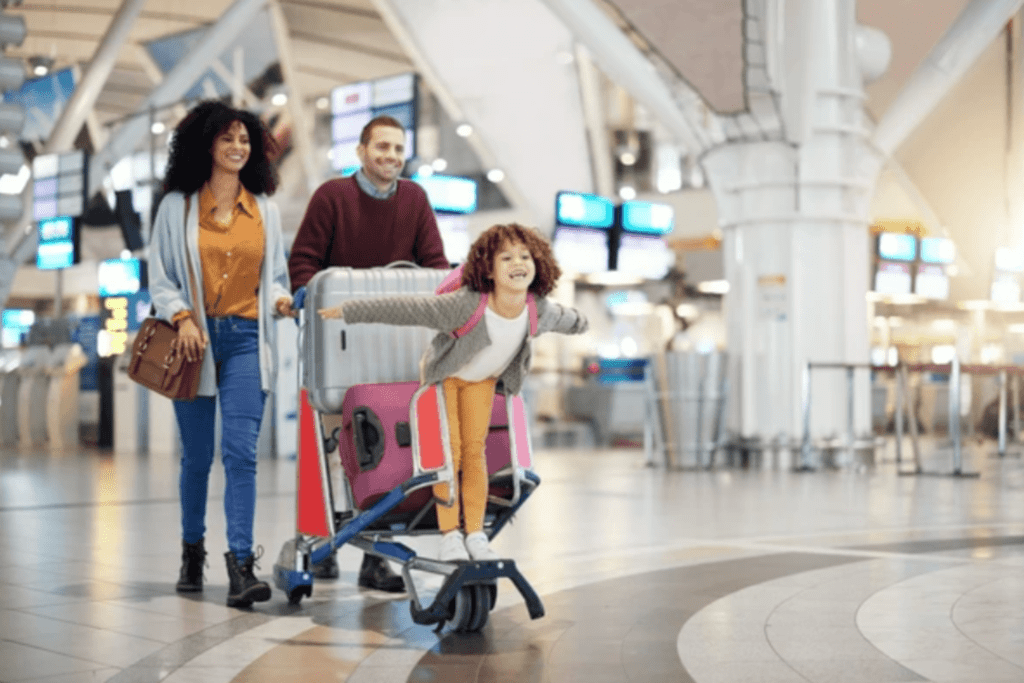 long-term family trips featured image mom and dad with daughter navigating airport